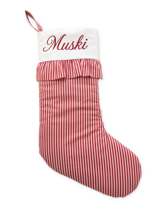 Bon Bon stocking with its original Muski embroidery and photographed ruffled cuff, on white with a subtle shadow.