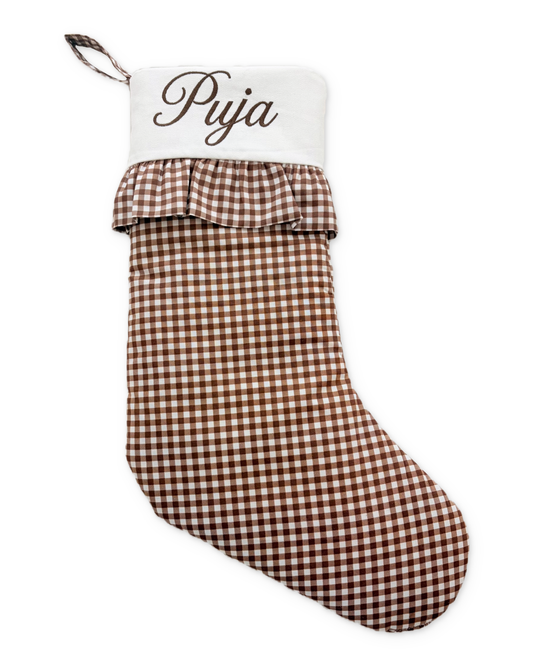 Chocolate stocking with its original Puja embroidery and photographed ruffled cuff, on white with a subtle shadow.