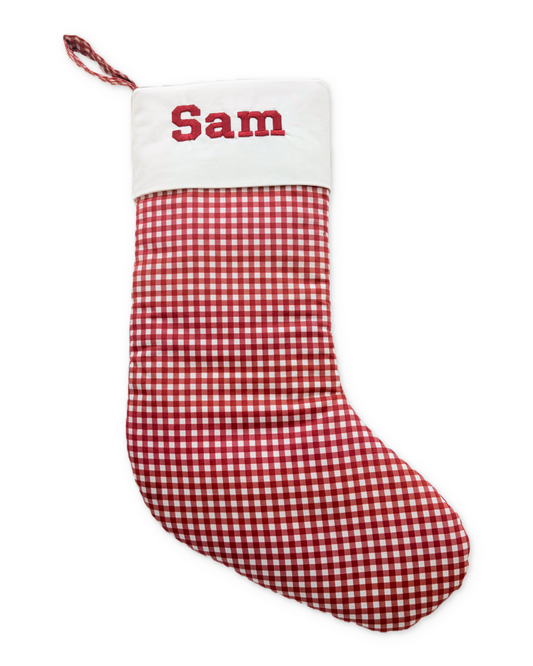 Holly stocking with its original Sam embroidery and photographed classic cuff, on white with a subtle shadow.